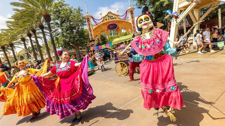 The Dia de los Muertos celebration in California Adventure features a musical street performance inspired by "Coco."