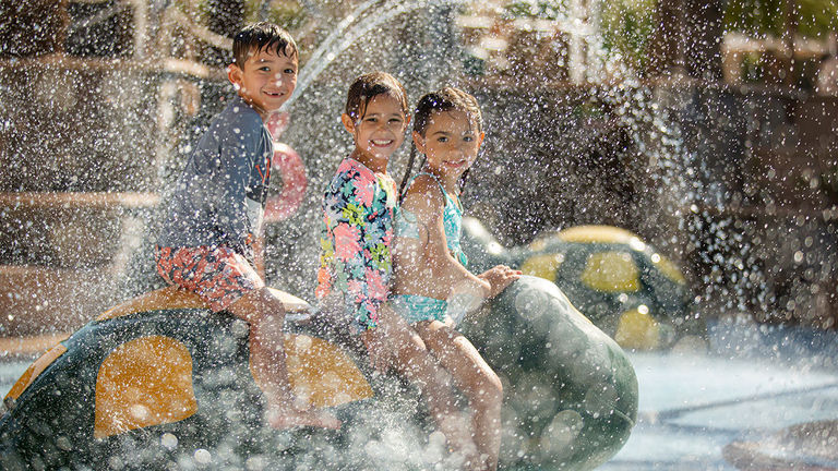 Young kids will love the interactive water features in the pool area.