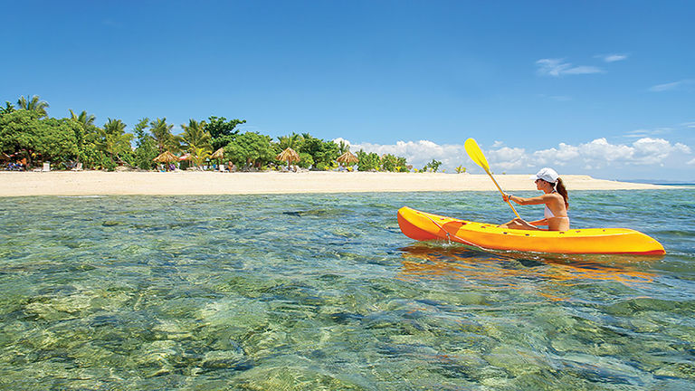 Kayaking in the idyllic Mamanuca Islands, Fiji, is one of many experiences that might be added to a customized Avanti tour in the region.