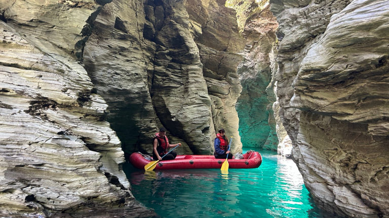 On a “funyak” excursion out of Queenstown, participants paddle inflatable kayaks along the spectacular scenery of the Dart River.