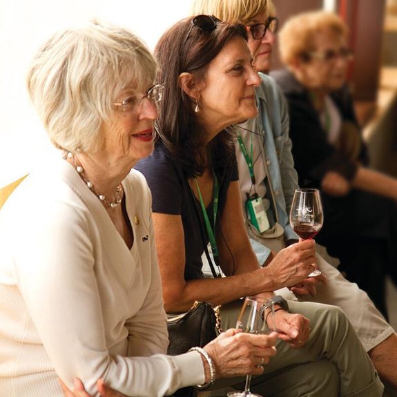 Travelers enjoy a wine tasting at Quinta dos Vales Winery in Estômbar, Portugal during a Tauck Women's-Only Departure.