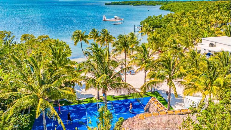 Clients can play pickleball on a private beach in the Florida Keys.