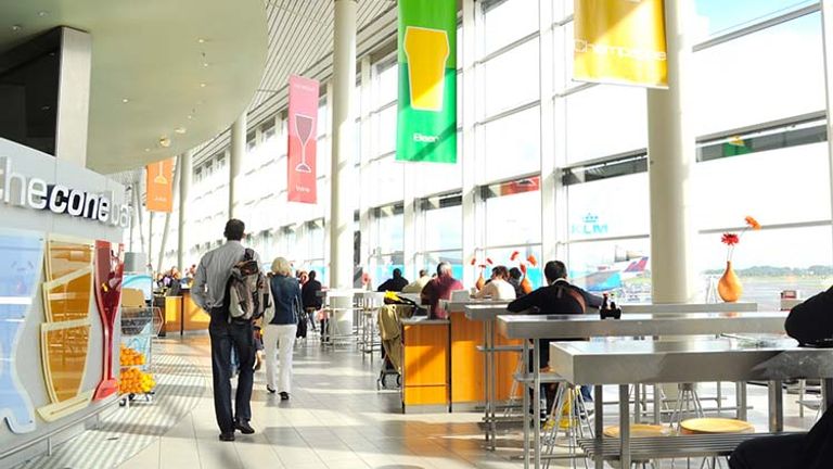 Avoid layover-associated dread by flying into one of the world’s best airports, such as Amsterdam Schiphol Airport, which has a casino and a library. // © 2014 Creative Commons user sharonhahndarlin