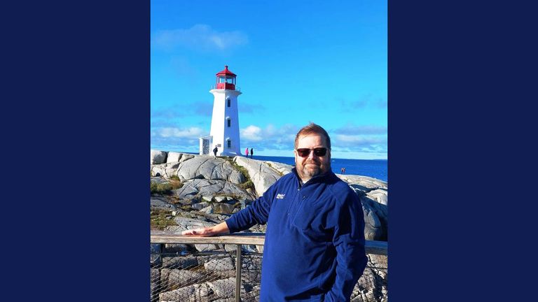 Henry Dennis stands in front of Peggy’s Cove Lighthouse in Nova Scotia, Canada. Henry Dennis stands in front of Peggy’s Cove Lighthouse in Nova Scotia, Canada.