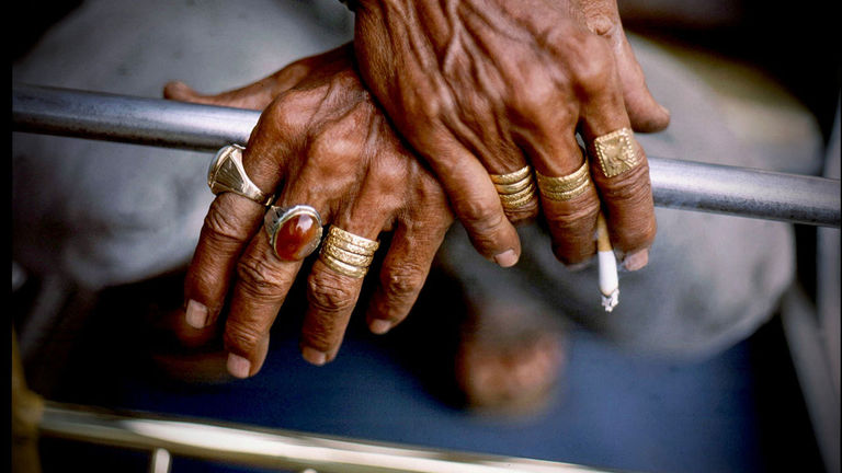 A man’s hands reveal aspects of his identity.