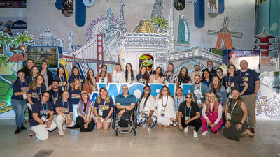 Keynote speaker Spencer West (center) poses with fellow Ascend attendees.