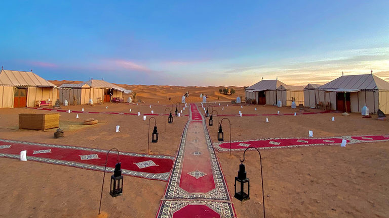 After a day spent on active adventures in the Sahara, retreat to a luxury tent.