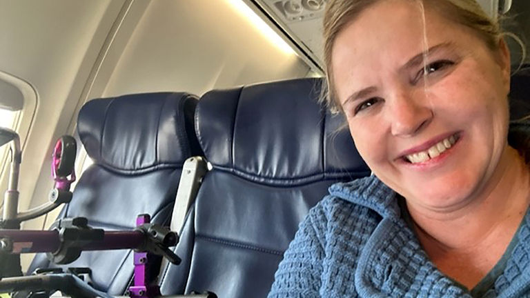 The writer flies with her mobility device