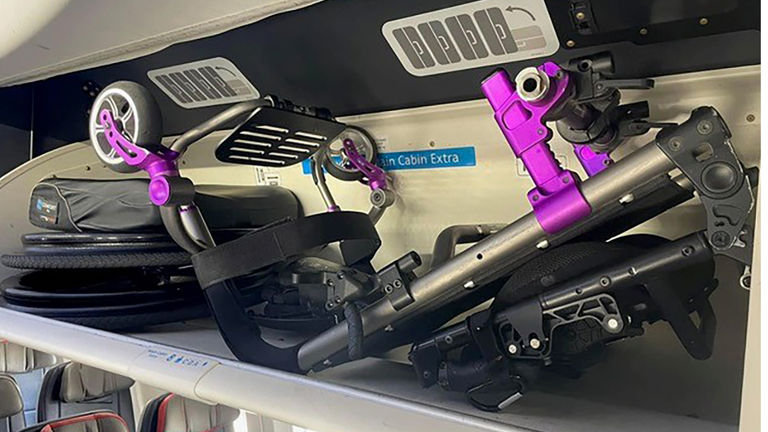 A mobility device may be stored in an aircraft's overhead bin.
