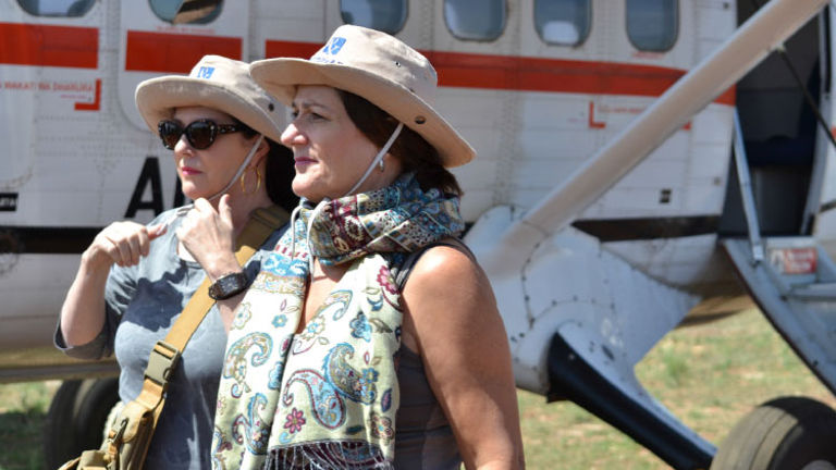 Travel agent Susan Talbot (right) and sister Lucie exit a plane from Samburu to the Mara. // © 2015 Africas Best Photos