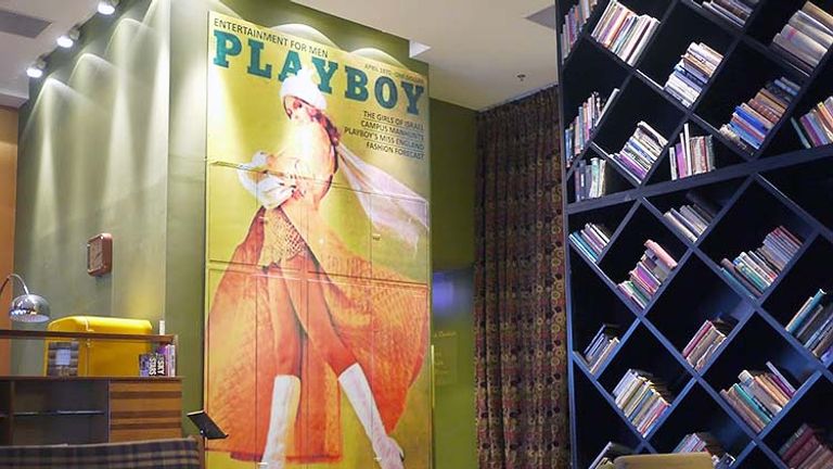 The lobby of the Brown TLV is stacked with books and cozy seating. // © 2015 Terra Judge