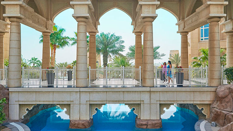 Swim under the bridge to a secluded pool. // © 2015 Christian Horan/Four Seasons Hotel Doha