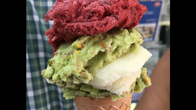 This cone features layers of pistachio, raspberry and ashta ice cream flavors. // © 2017 Giselle Abcarian