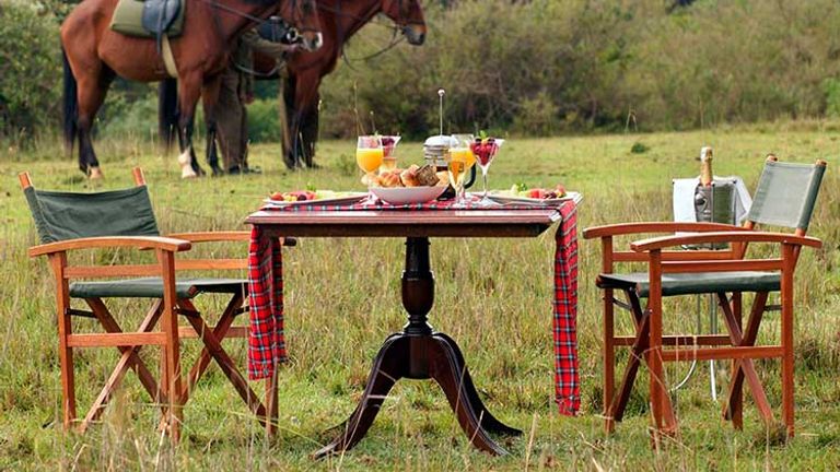 Guests can reserve a bush breakfast or dinner on the edge of the property, reached by a walk or a short horseback ride. // © 2016 Fairmont Mount Kenya Safari Club