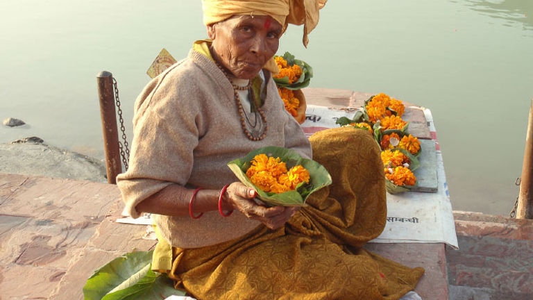 A woman sells marigolds // © 2014 Thinkstock