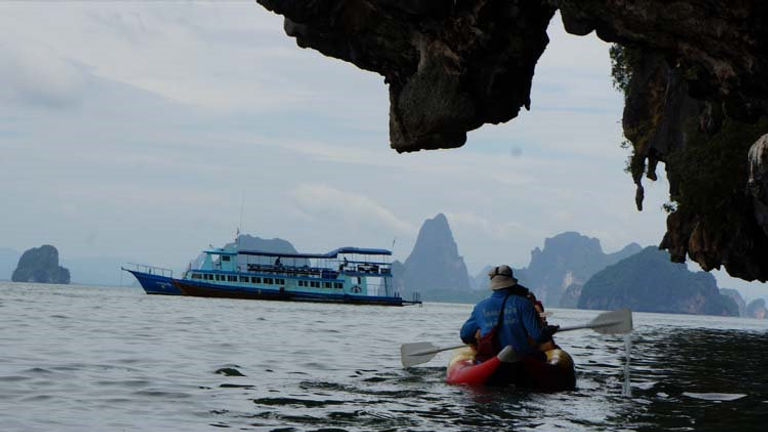 Sea Cave Canoe takes guests close to the islands interior pools. // (c) 2013 Deborah Dimond