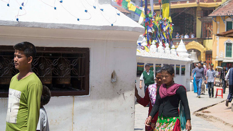 Visitors to Kathmandu’s Boudhanath Stupa can also visit a Tibetan monastery. // © 2015 Mindy Poder