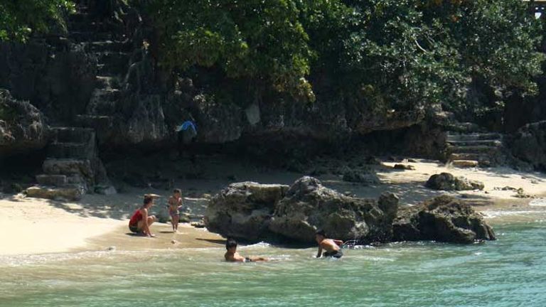 Quezon Island is an ideal spot for swimming, with gentle green waters enveloping the shoreline. // (c) 2013 Nila Do