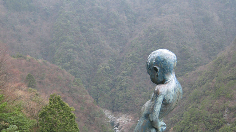The “peeing boy statue” is perched at the top of a 200-meter cliff overlooking the valley. // © 2015 Tourism Shikoku and Japan National Tourism Organization