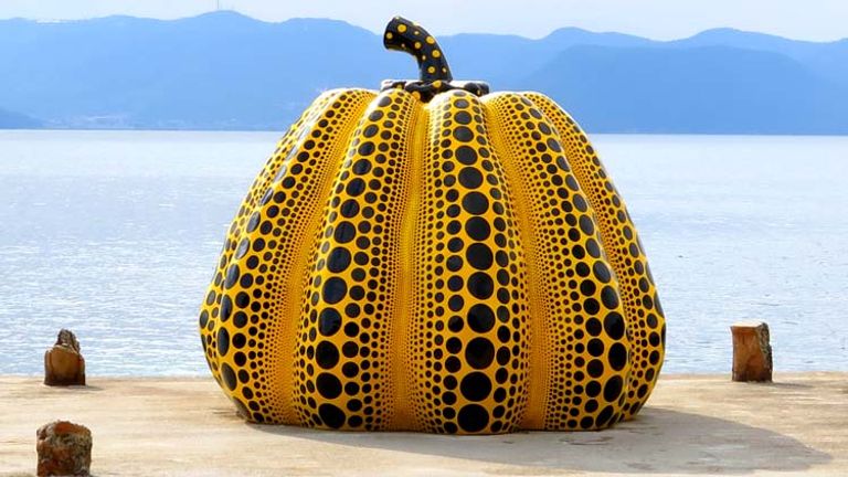 Naoshima Island attracts art lovers with its large collection of contemporary art, including this fiberglass pumpkin by Yayoi Kusama. // © 2014 Boutique Japan