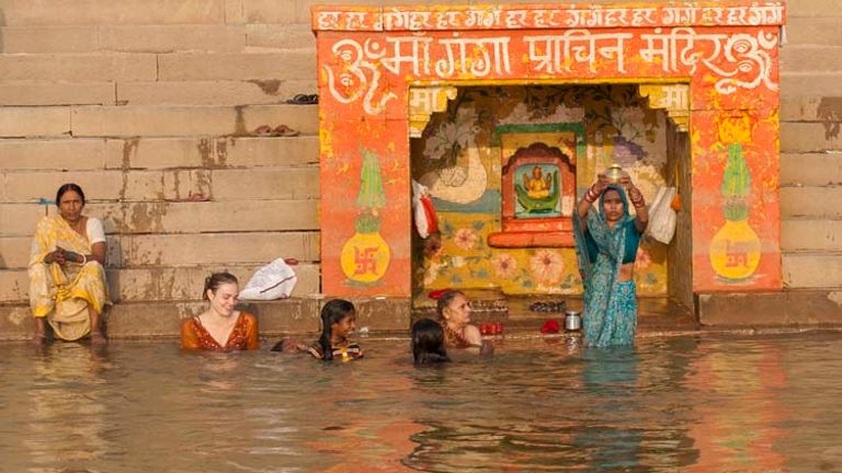 Unlike men, women must be fully covered when entering the Ganges River. // © 2014 Mindy Poder