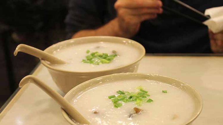 Known as joke in Thailand, rice congee is a simple and satisfying breakfast dish that can be dressed with toppings including fried garlic, century egg, pickled turnips and more. // © 2017 Creative Commons user ironypoisoning