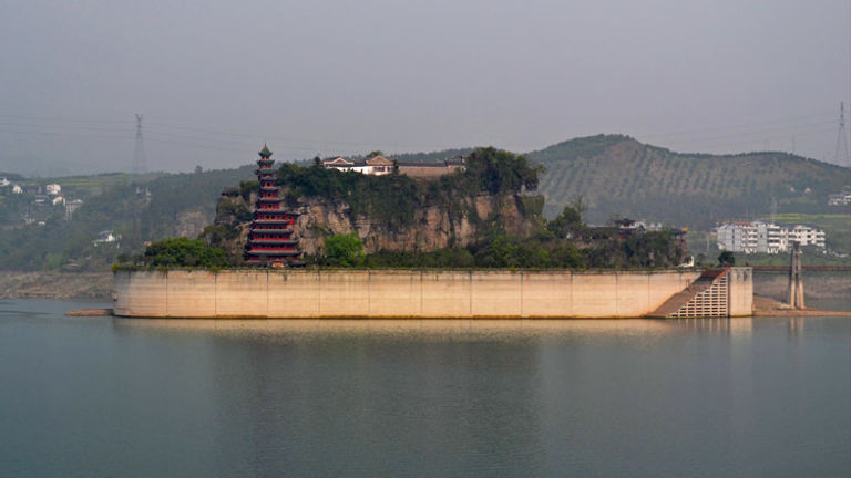 Shibaozhai, nicknamed the bonsai tree of the Yangtze River, is a popular river cruise excursion. // © 2013 Mindy Poder