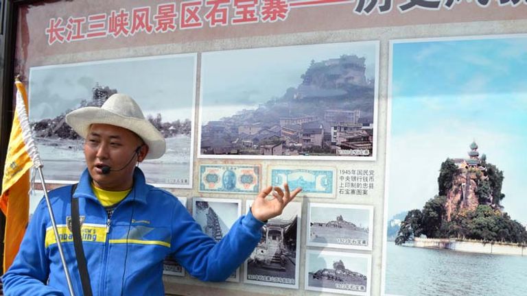 Century Cruises hires a local guide who explains the changes `has undergone since the Three Gorges Dam. // © 2013 Mindy Poder