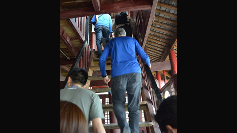 Advise clients to wear comfortable shoes and pants as the Shibaozhai excursion requires climbing uneven, rickety steps. // © 2013 Mindy Poder