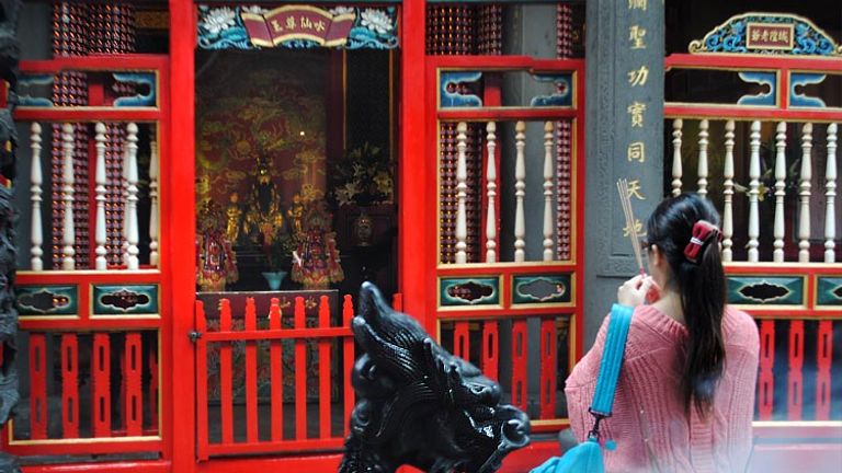 Founded in 1738, Longshan Temple is dedicated to the Buddhist Goddess of Mercy but includes Taoist deities as well. // © 2014 Mindy Poder