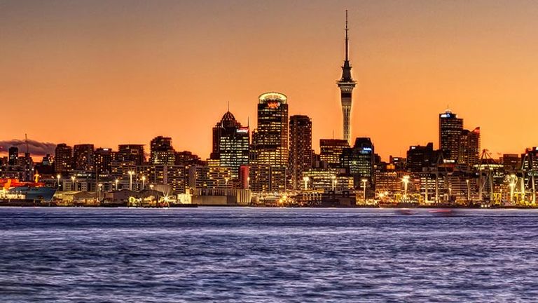 The North Island road trip begins in Auckland, with a spectacular sunset view of the iconic Sky Tower. // © 2017 Creative Commons user sxbaird