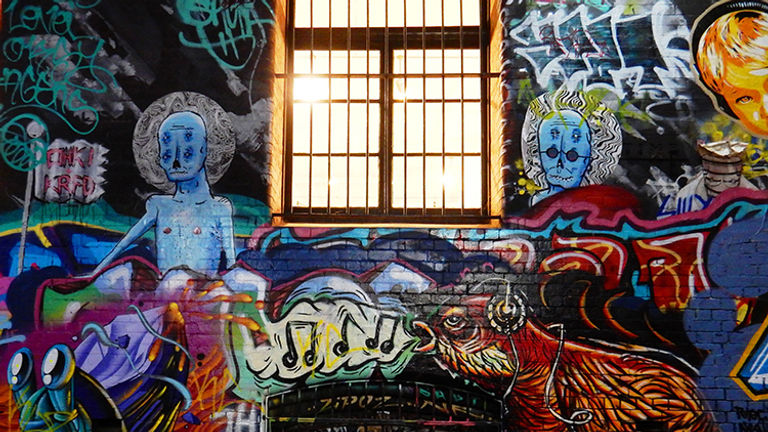 Hosier Lane, a narrow alley in Melbourne, is home to a wide array of colorful murals. // © 2015 Shane Nelson