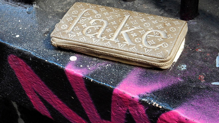 This cement replica of a Louis Vuitton purse is found in Melbourne’s Hosier Lane. // © 2015 Shane Nelson