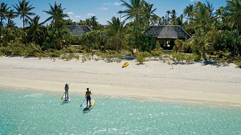 If guests can tear themselves away from their luxurious villas and private pools, they can explore the nearby lagoon by paddleboard. // © 2015 Tim-McKenna.com