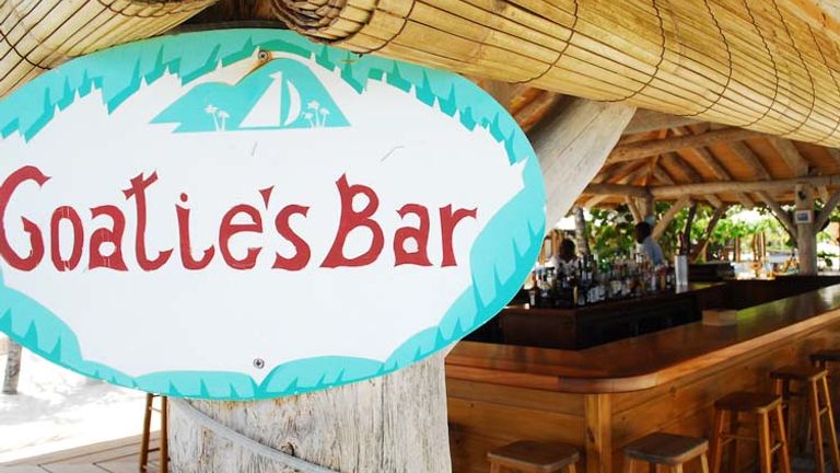The beachside Goatie’s bar, named after the resort’s longest standing employee, is an ideal location for watching the sunset while enjoying a tropical beverage. // © 2014 Petit St. Vincent