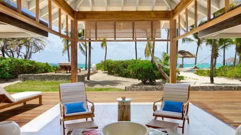 The resort’s 22 luxurious cottages have modern upscale perks, including Nespresso machines and Bose iPod docks, but there are no televisions and no Internet access. // © © 2014 Petit St. Vincent