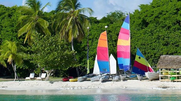 Sailboats are available for chartered trips to nearby attractions such as Tobago Cays, a group of small islands surrounded by extensive reef. // © 2014 Petit St. Vincent