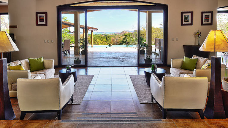 The lobby opens to the dining area by the pool. // © 2015 Villa Buena Onda