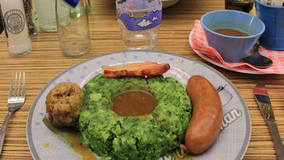 When traveling in the Netherlands, stamppot is a must-try traditional dish, a mixture of boiled potatoes and vegetables served alongside rookworst, or Dutch smoked sausage. // © 2014 David Wade