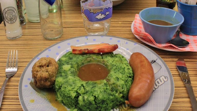 When traveling in the Netherlands, stamppot is a must-try traditional dish, a mixture of boiled potatoes and vegetables served alongside rookworst, or Dutch smoked sausage. // © 2014 David Wade