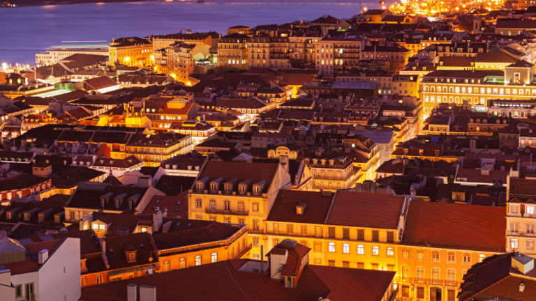 The city of Lisbon is magical at nighttime. // © 2017 iStock