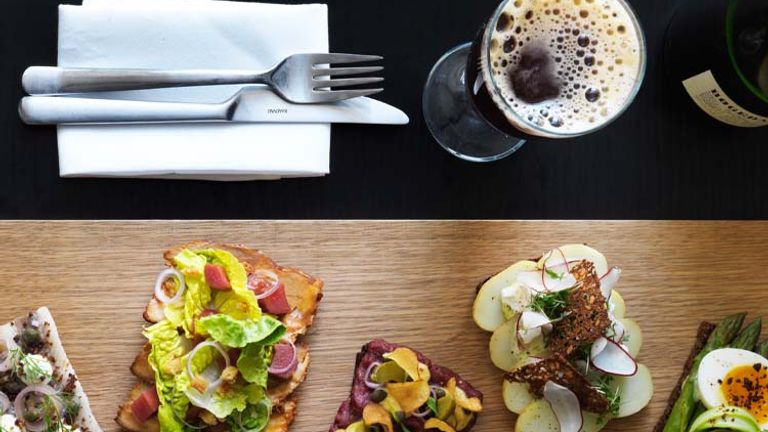 Visitors might sample Nordic cuisine at a number of renowned Copenhagen restaurants, including Aamanns Smorrebrodsdeli, where traditional smorrebrod (Danish open-faced sandwiches) get a modern twist. // © 2014 Columbus Leth