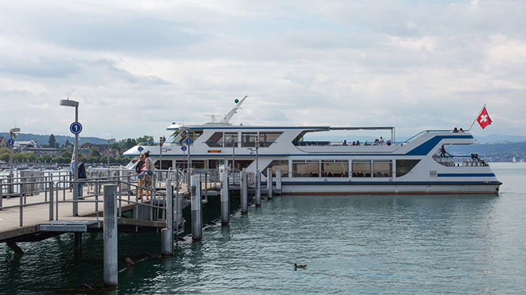 To travel Lake Zurich, board one of the boats at the dock at the Burkliplatz Station in Zurich. // © 2018 Ben McBee