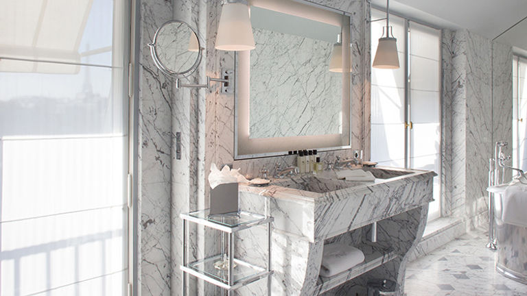 Bathrooms are outfitted with Carrara and Turquin blue marble. // © 2015 La Reserve Paris Hotel and Spa