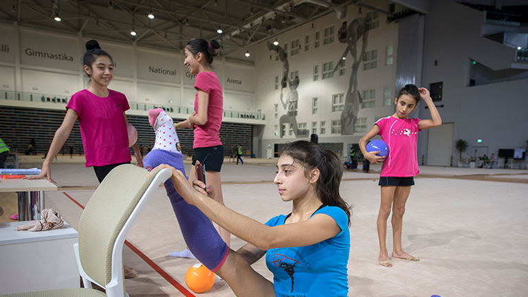 The Rythmic Gymnastics team members practice at the National Gymnastics Arena in Baku. // © 2015 Mark Edward Harris