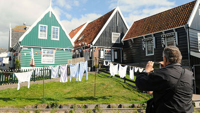 Go beyond Amsterdam to see charming fishing villages and windmill-filled towns that still nostalgically depict Holland’s yesteryear. // © 2016 Toms Travel Tours