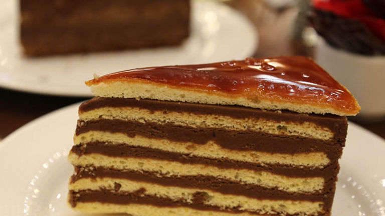 Order a dobos torte, a Hungarian sponge cake layered with chocolate buttercream and topped with caramel. // © 2016 Mindy Poder