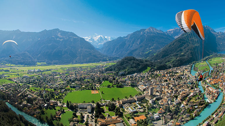 Multiple operators offer tandem paragliding or hang-gliding flights over Interlaken year-round (weather permitting). // © 2016 Interlaken Tourism