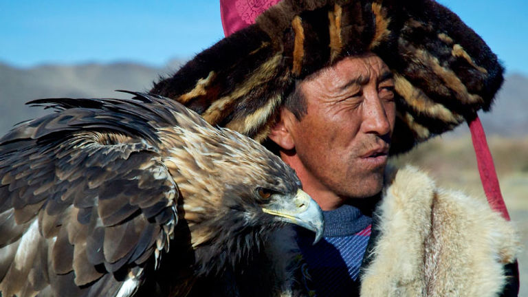 Mongolian man with eagle, Second Place, 2015 TravelAge West reader photo contest // © 2015 Wanda Bogacka-Plucinski