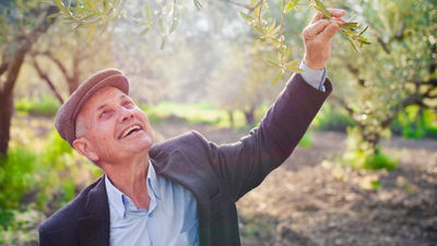 Tour operators are increasingly focusing on “people-to-people” experiences for travelers, such as meeting olive farmers in Crete. // © 2016 iStock